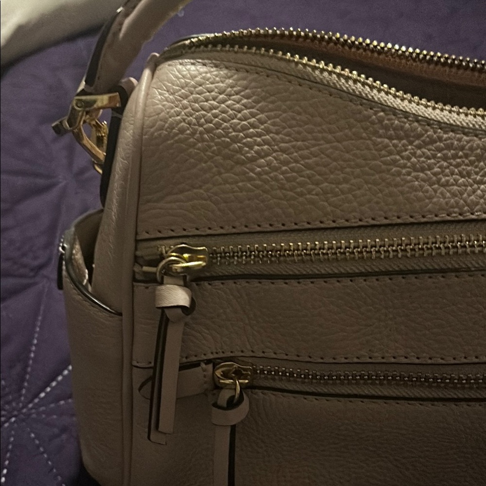 MK. Peachy colored satchel with Pebbled Texture and Structured. Barely used
